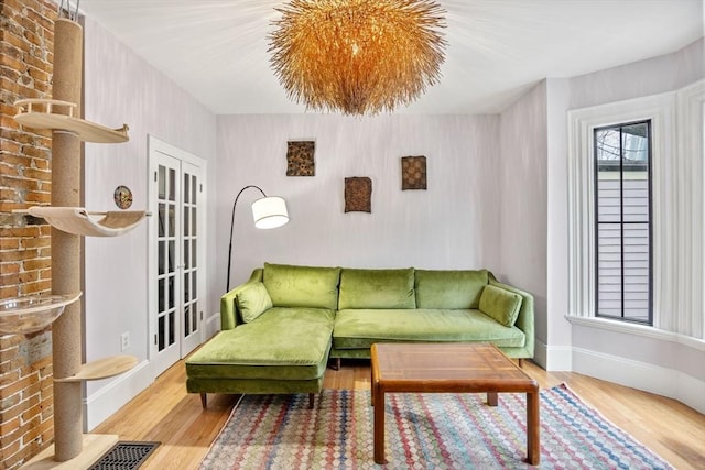 30 Howard St, Cambridge, MA 02139 - living area featuring wood finished floors and baseboards