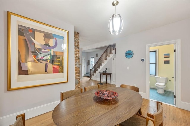 30 Howard St, Cambridge, MA 02139 - dining area with wood finished floors, stairway, and baseboards