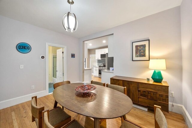 30 Howard St, Cambridge, MA 02139 - dining area featuring baseboards, light wood-style flooring, and recessed lighting