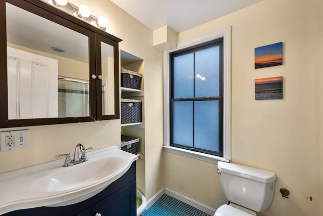 30 Howard St, Cambridge, MA 02139 - bathroom with baseboards, toilet, healthy amount of natural light, and a shower with shower door
