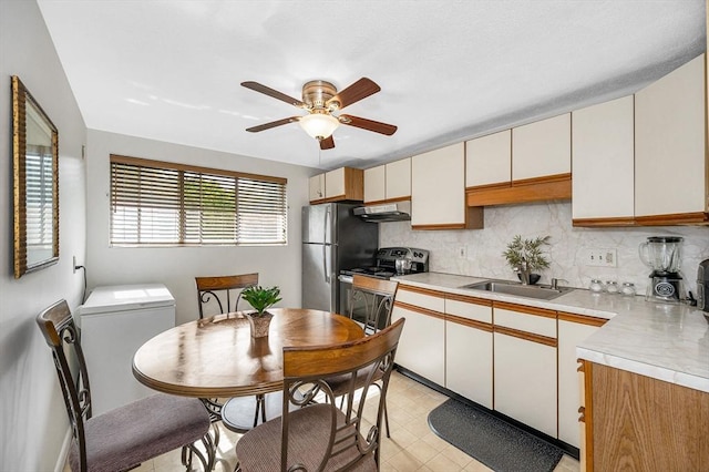 10 Woodcrest Ct Unit 6, Weymouth, MA 02190 - kitchen with appliances with stainless steel finishes, a sink, light countertops, and backsplash