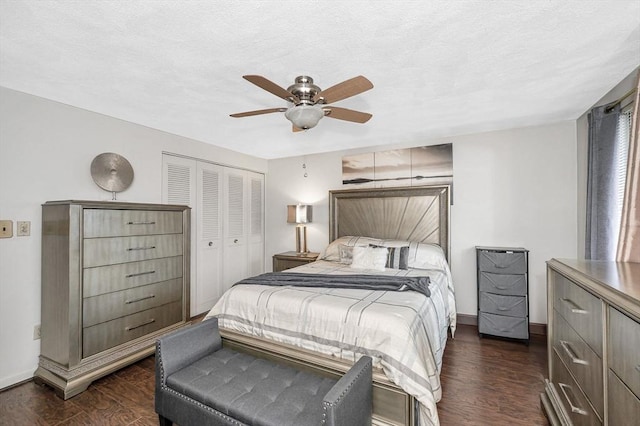 10 Woodcrest Ct Unit 6, Weymouth, MA 02190 - bedroom with dark wood-style flooring, a closet, baseboards, and a ceiling fan