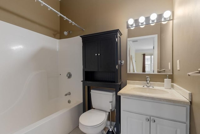 bathroom with toilet, vanity, and washtub / shower combination