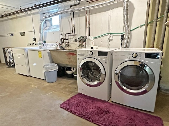 clothes washing area featuring laundry area and washing machine and clothes dryer