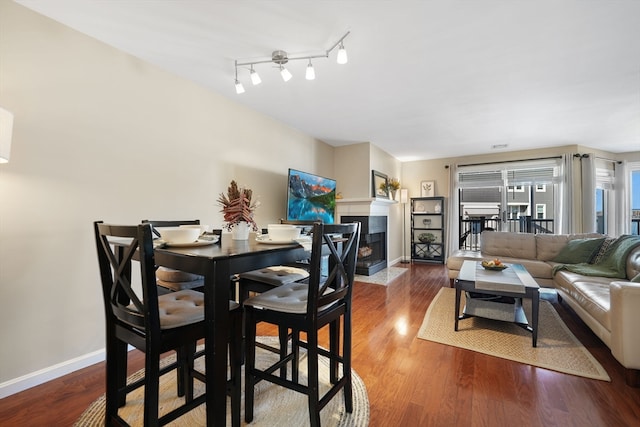 dining room with wood-type flooring