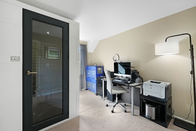 office space featuring light colored carpet and lofted ceiling