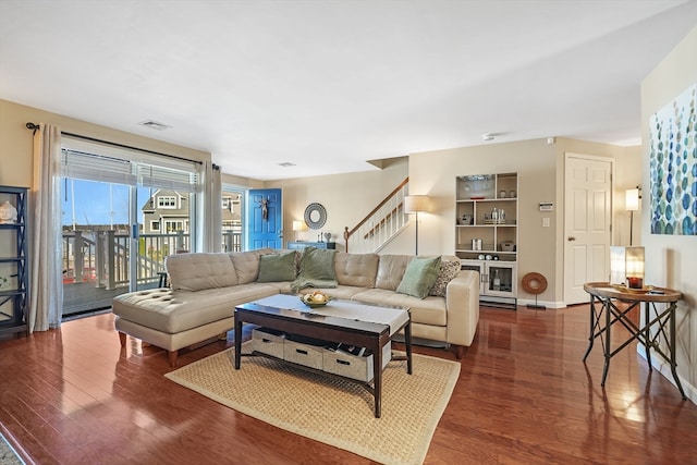 living room with dark hardwood / wood-style floors