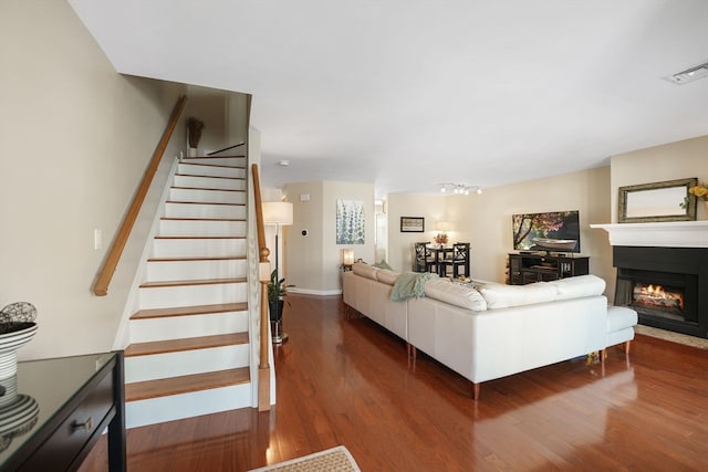 living room with dark hardwood / wood-style floors