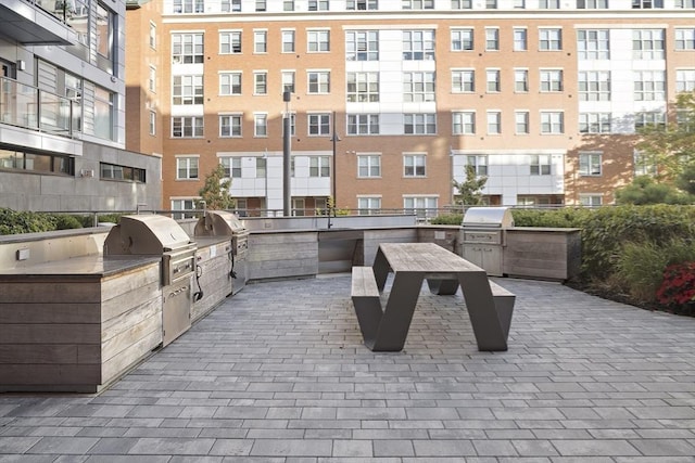 view of community with exterior kitchen