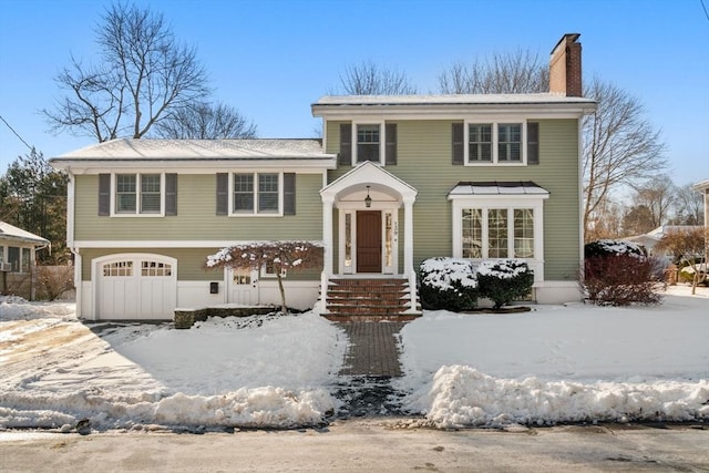 view of front of property with a garage