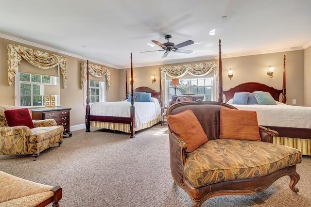 carpeted bedroom featuring ornamental molding, baseboards, and a ceiling fan