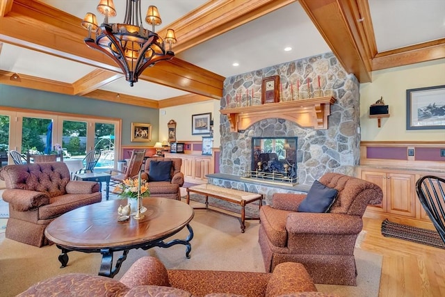 living room with a notable chandelier, a fireplace, and beam ceiling