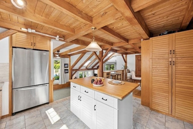 1292 Main St, Lancaster, MA 01523 - kitchen featuring freestanding refrigerator, a wooden ceiling with exposed beams, butcher block counters, hanging light fixtures, and white cabinetry