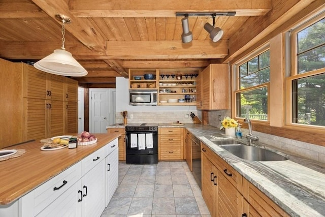 1292 Main St, Lancaster, MA 01523 - kitchen with black electric range, stainless steel microwave, a wooden ceiling with exposed beams, plenty of natural light, and decorative backsplash