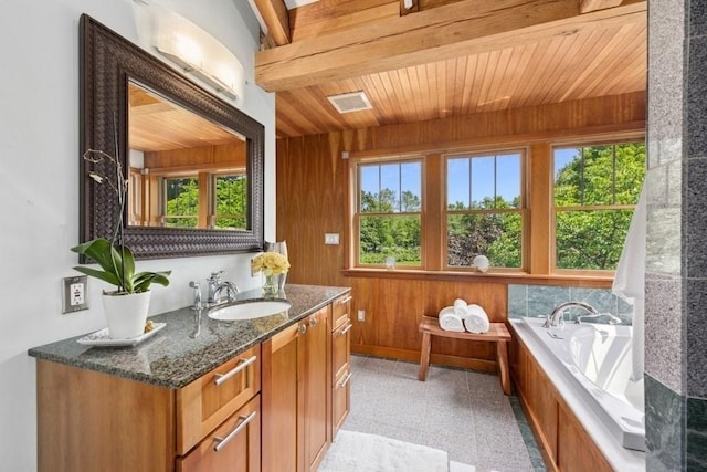 1292 Main St, Lancaster, MA 01523 - bathroom with vanity, wooden ceiling, a bath, wooden walls, and granite floors