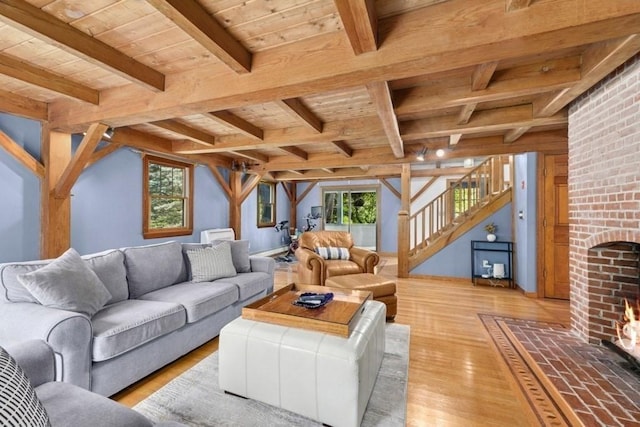 1292 Main St, Lancaster, MA 01523 - living room with a wooden ceiling with exposed beams, light wood-style flooring, stairway, and healthy amount of natural light