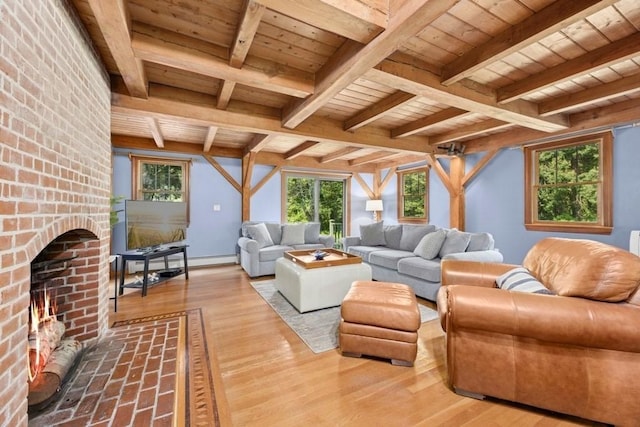 1292 Main St, Lancaster, MA 01523 - living area featuring a wooden ceiling with exposed beams, a fireplace, plenty of natural light, and wood finished floors