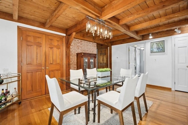 1292 Main St, Lancaster, MA 01523 - dining space featuring a wooden ceiling with exposed beams, light wood finished floors, and a chandelier