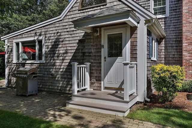 4 Wildwood Ave, Harwich, MA 02645 - view of exterior entry with a patio area