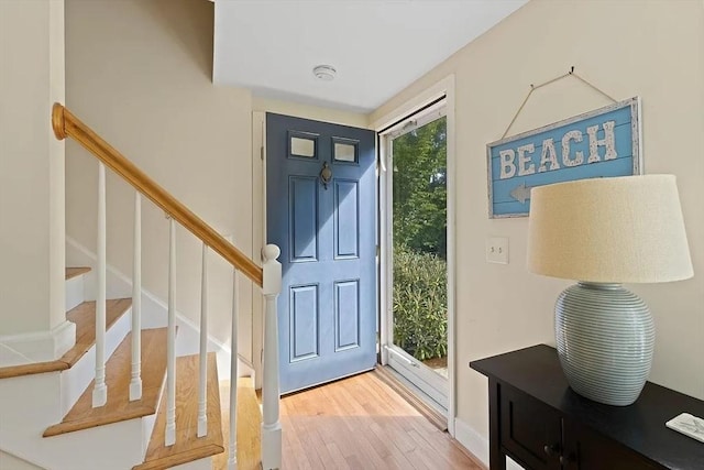 4 Wildwood Ave, Harwich, MA 02645 - foyer with wood finished floors and stairway