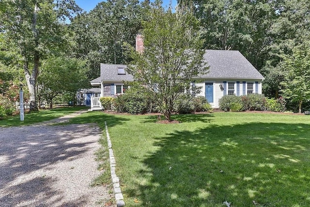 4 Wildwood Ave, Harwich, MA 02645 - view of front facade with a front lawn and a chimney
