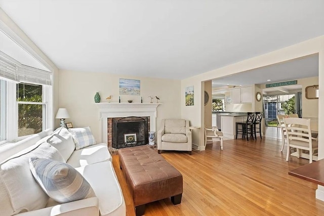 4 Wildwood Ave, Harwich, MA 02645 - living area featuring light wood-style floors and a fireplace