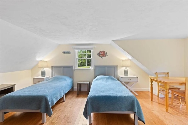 4 Wildwood Ave, Harwich, MA 02645 - bedroom featuring wood finished floors and lofted ceiling