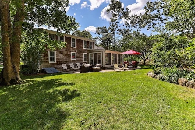 4 Wildwood Ave, Harwich, MA 02645 - rear view of house with a patio area, an outdoor living space, and a yard