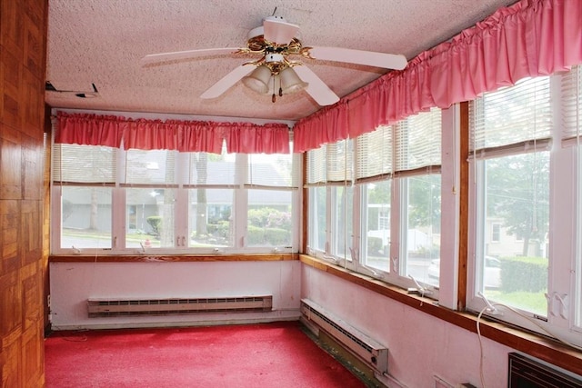 49 Newcomb Rd, Stoneham, MA 02180 - unfurnished sunroom featuring a baseboard radiator, a baseboard heating unit, plenty of natural light, and a textured ceiling