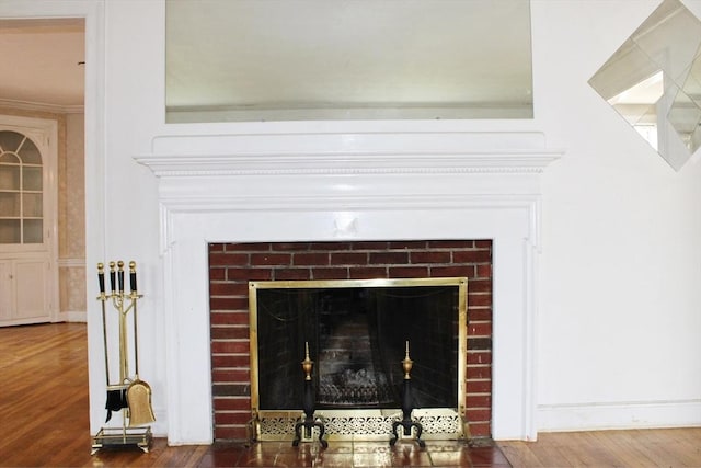 49 Newcomb Rd, Stoneham, MA 02180 - detailed view of a fireplace, wood finished floors, and crown molding