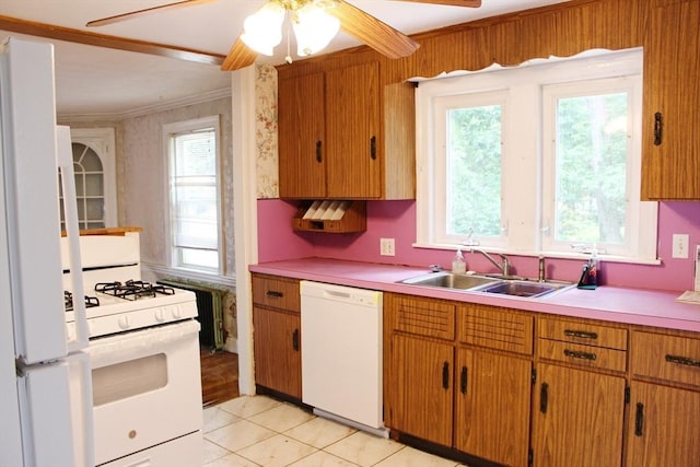 49 Newcomb Rd, Stoneham, MA 02180 - kitchen with white appliances, light countertops, crown molding, ceiling fan, and light tile patterned flooring