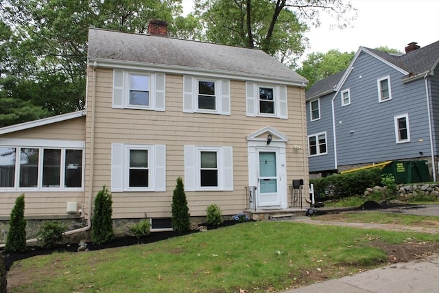 49 Newcomb Rd, Stoneham, MA 02180 - colonial house with a chimney and a front lawn