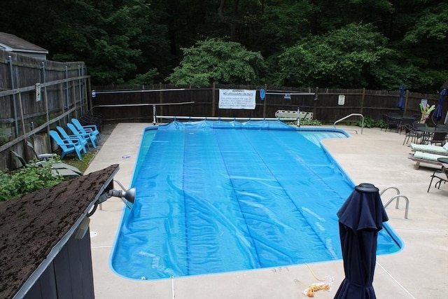 49 Newcomb Rd, Stoneham, MA 02180 - community pool featuring a fenced backyard and a patio
