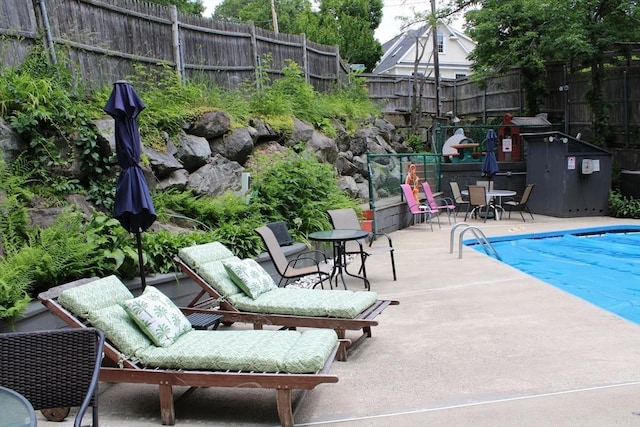 49 Newcomb Rd, Stoneham, MA 02180 - community pool featuring a patio area and outdoor dining space