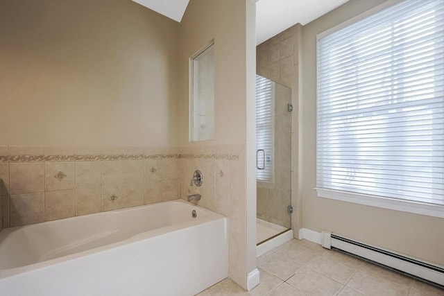 bathroom featuring a baseboard heating unit, a wealth of natural light, tile patterned floors, and shower with separate bathtub