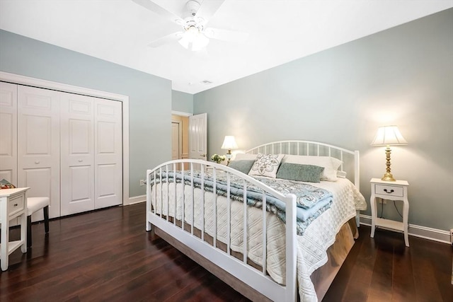 bedroom featuring dark wood-type flooring, a closet, and ceiling fan