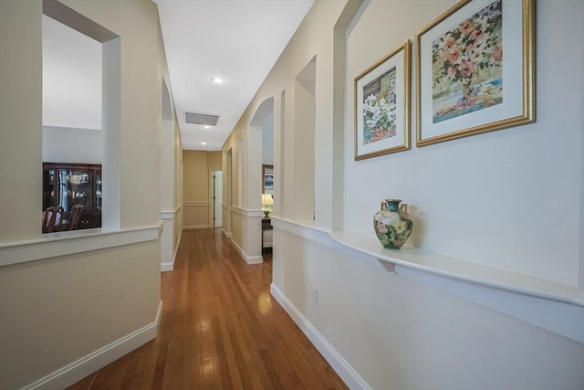 hallway featuring hardwood / wood-style flooring