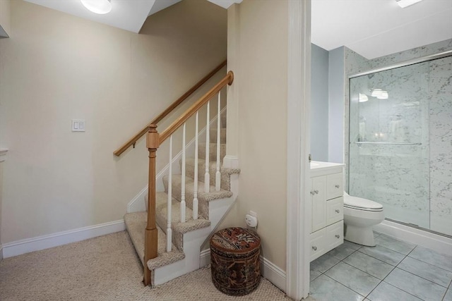 staircase featuring tile patterned floors