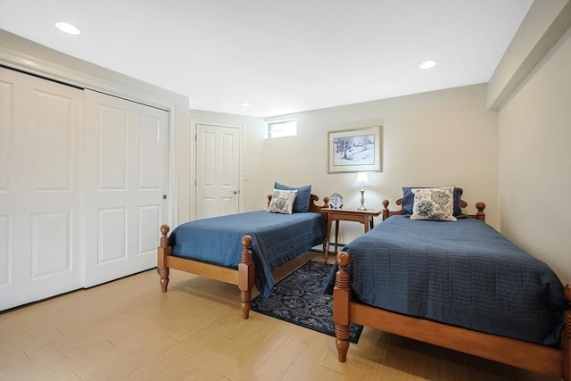 bedroom with a closet and light wood-type flooring