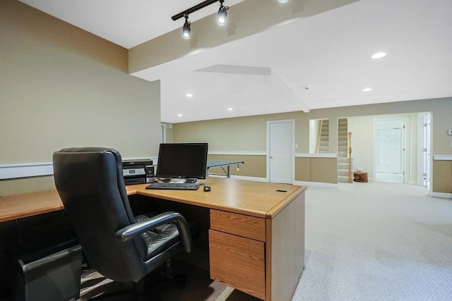 carpeted office space featuring rail lighting