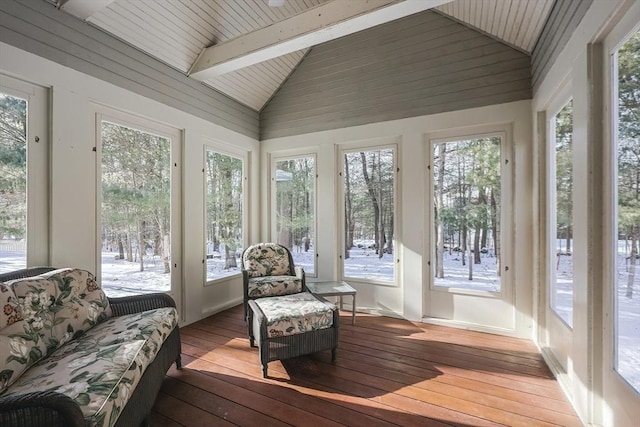 sunroom / solarium with lofted ceiling with beams