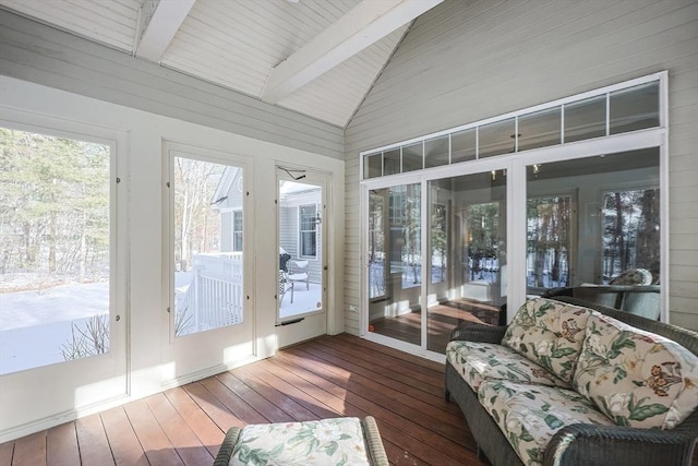 sunroom with vaulted ceiling with beams