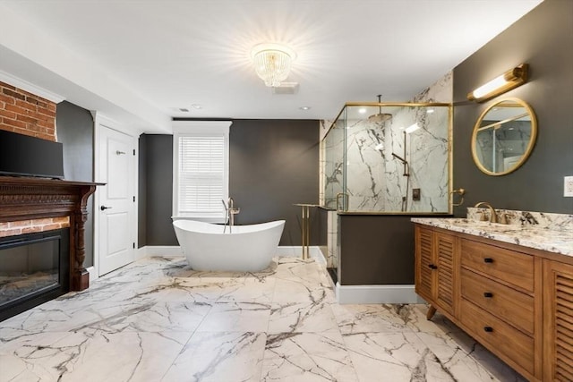 bathroom with vanity, a marble finish shower, marble look tiles, a soaking tub, and a brick fireplace