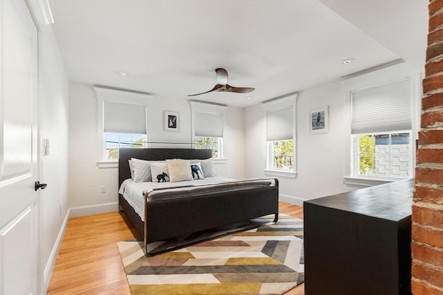 bedroom featuring light wood-type flooring, baseboards, ceiling fan, and recessed lighting