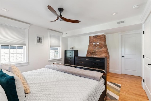bedroom featuring multiple windows, light wood-style flooring, recessed lighting, ceiling fan, and baseboards
