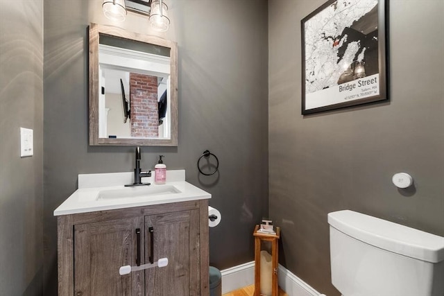 bathroom with toilet and vanity