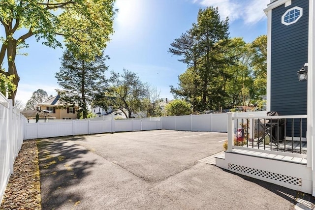 view of patio / terrace with fence and a deck