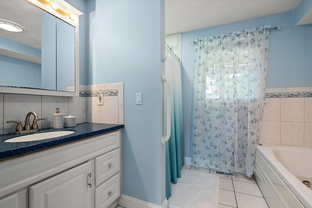 23 Hanson St, Wakefield, MA 01880 - bathroom with tile patterned flooring, vanity, tile walls, and shower / tub combo with curtain