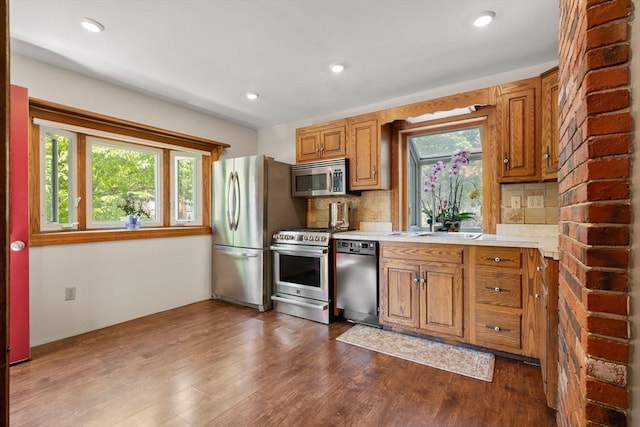 23 Hanson St, Wakefield, MA 01880 - kitchen with appliances with stainless steel finishes, plenty of natural light, light countertops, decorative backsplash, and recessed lighting