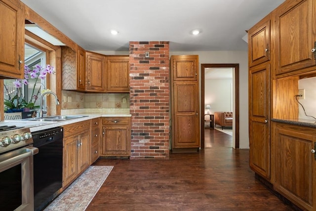 23 Hanson St, Wakefield, MA 01880 - kitchen with a sink, stainless steel stove, black dishwasher, brown cabinets, and recessed lighting